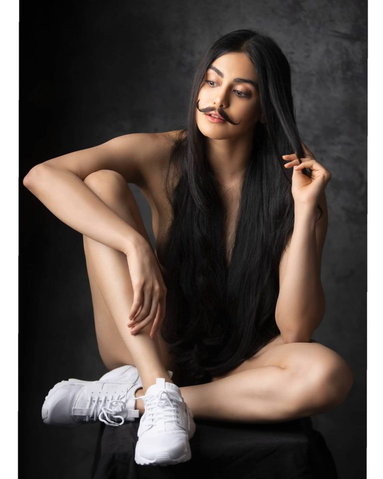 Adah Sharma only covered with hair