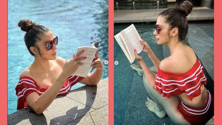 Bikini beauty reading book in pool